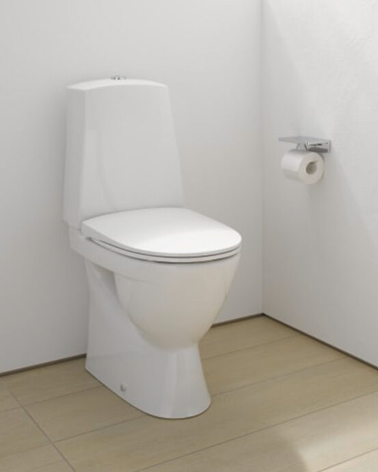 Kuvassa korotettu valkoinen Laufen Kompas Pro-N -WC-istuin. WC-tilassa valkoiset seinät ja seinällä WC-paperiteline. Tuotenumero: H8279670007381